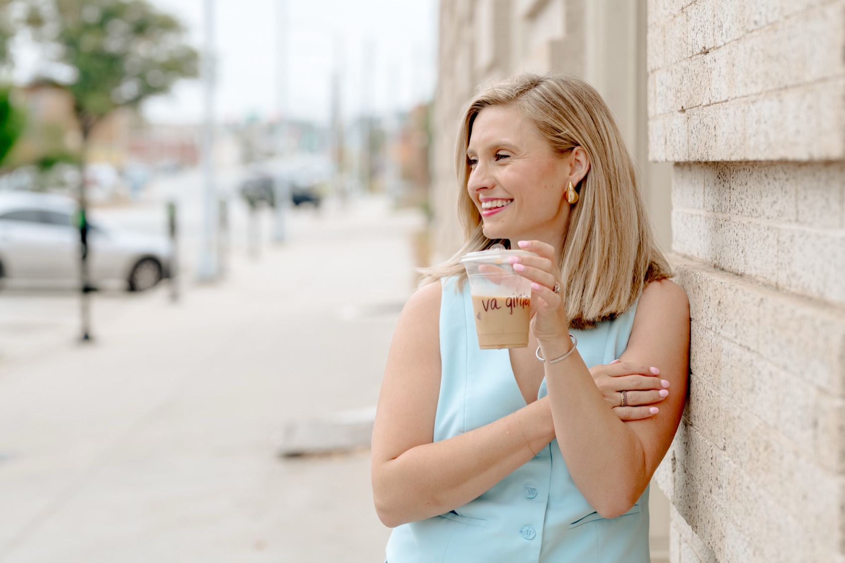 Haley with coffee, looking out